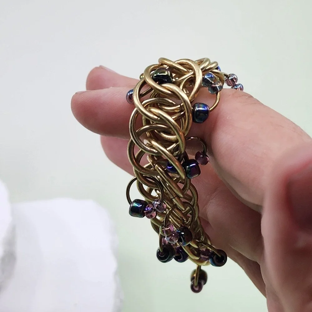 Kenneth Cole Gold Tone Woven Ring Bracelet Purple Bead Chunky Toggle Statement